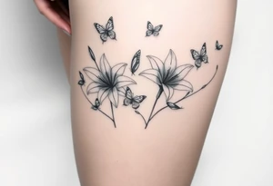 5 to 7 lily blooms in a natural stager with 2 that have petals floating off that gradually dissolve into butterflies in various stages of flight tattoo idea