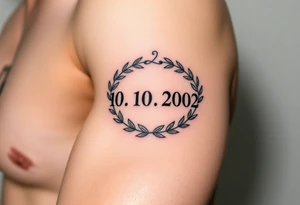 roman numerals (10.10.2002) in laurel crown in an ancient roman styles tattoo idea