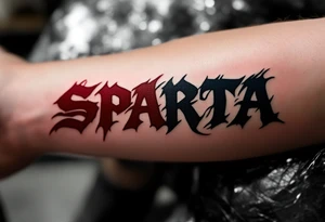 The word “SPARTA” written in Gothic script across the forearm, half in hockey red, half in football maroon. tattoo idea