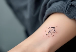 A Sagittarius constellation with stars as tiny gold dots connected by soft gray lines above the collarbone tattoo idea