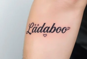 The name Ladaboo with stars and hearts around the name tattoo idea