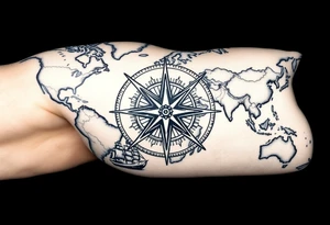 antique compass rose overlaid on weathered world map with sailing ships tattoo idea