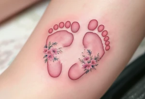 Soft pink and white footprints of Nikol, with a crown of little flowers around the prints, representing her royal and sweet essence. tattoo idea