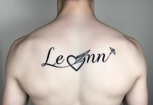 The name Leann going down my ribs with a heart and paper plane tattoo idea