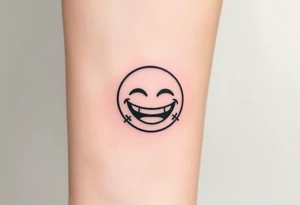 Laughing emoji with stiches tattoo idea