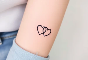 two wedding rings as two interlock hearts tattoo idea