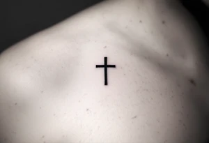A small, sharp-edged black cross tattoo placed just beneath the outer corner of the eye. tattoo idea