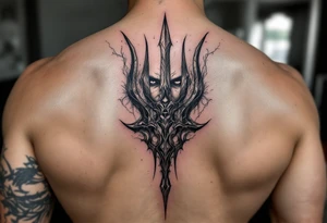 face behind trident tattoo idea