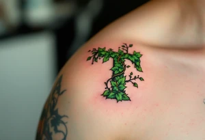 A leaf-textured "T" in forest green with tiny vines wrapping around it. tattoo idea