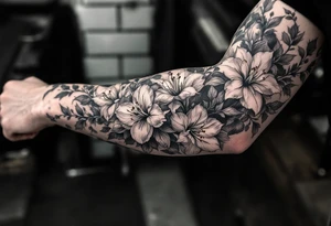 1 black band with roman numerals near elbow and 1 black band lower forearm, both with roman numerals in them. between the black bands fill the space with narcissus flowers and holly tattoo idea