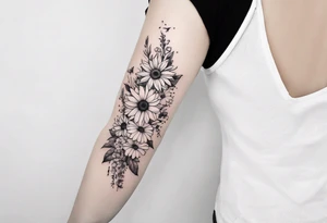 Floral sleeve tattoo with sunflower, daisies, roses, bleeding heart flowers, asters, baby’s breath, humming birds, spiders, butterflies, bees, and greenery. tattoo idea