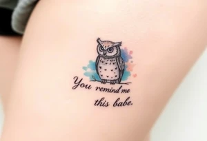 Small owl with water color background and “You remind me of the babe” in script tattoo idea