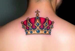 A regal gold crown tattoo adorned with deep red velvet lining, shimmering sapphire-blue gemstones, and subtle black shadowing underneath to give it a bold, three-dimensional look. tattoo idea