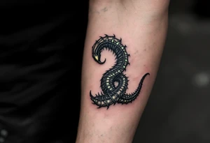 A dark Xenomorph tail spiraling around the arm, with segments that glow in a soft greenish hue, contrasting the black of the body. tattoo idea