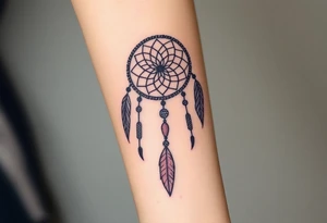 native dreamcatcher with flowing feathers and sacred beads tattoo idea