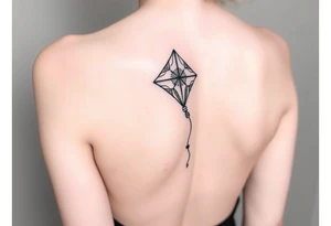 hand letting go kite tattoo idea