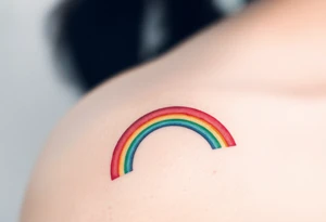 A rainbow with a halo above it to honour a rainbow baby tattoo idea