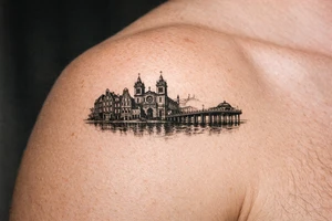 Cityscape silhouette of Amsterdam canal houses and Braga cathedral, with New Brighton pier. tattoo idea