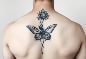 Elegant spine tattoo with lotus flower and butterfly with cracked wings mid back down tattoo idea