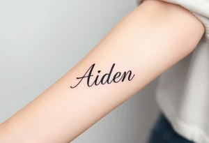 The name Aiden thick
 and bold cursive tattoo idea