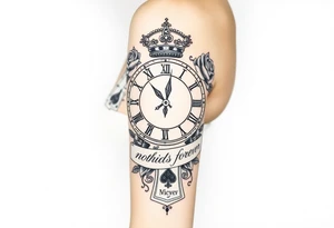 Roman clock with roses and a crown,  a quote that says nothings forever. and on the bottom a deck of cards tattoo idea