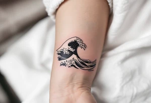 A minimalist black wave symbolizes the free and uncontrollable nature of the sea. tattoo idea