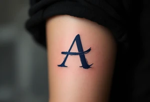 A brushstroke "A" in deep navy blue, fading into a smoky gray. tattoo idea