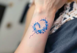 An ethereal Aries tattoo uses dots of light-blue and white to form the constellation in a dreamy galaxy swirl. tattoo idea
