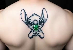 Stitch holding emerald birthstone for forearm tattoo idea