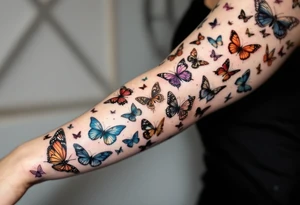 Many different butterflies in many different sizes and colors at least one monarch and in many stages of flight tattoo idea