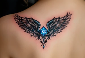 A pair of black ink wings cradling a small, glowing blue gem with the son’s initials KS inside. tattoo idea