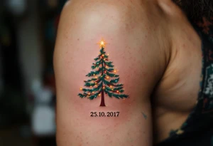 Leo 25. 10. 2017 – A red, green, and gold Christmas tree adorned with tiny sparkling lights, with Leo's birthdate below in elegant silver script. tattoo idea