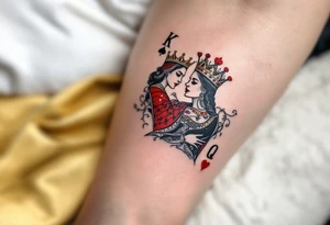 Two playing card symbols—King of Spades and Queen of Hearts—done in black, red, and subtle shading. tattoo idea