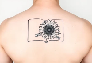 An open book with a sunflower and bees as one page tattoo idea