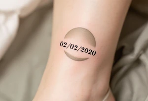 Simple 02.02.2020 in thin uppercase type and a muted olive green circle behind it. tattoo idea