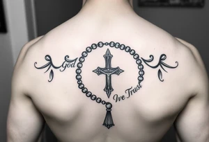 Rosary surrounded by the words "In God We Trust" tattoo idea