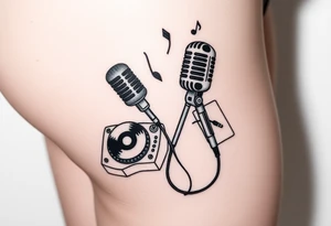 Microphone turntables and music notes on a woman's thigh tattoo idea