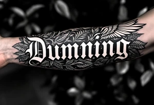 Dunning, left forearm details include angel wing, greek type of font,jungle leaves, name is big and in white color tattoo idea