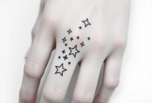 tattoo on back of hand and around fingers that includes stars and had a cool design made of lines tattoo idea