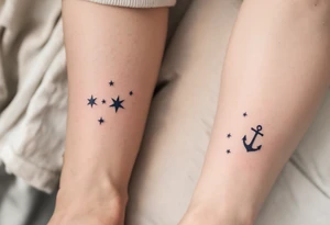 Matching man woman tattoo of nautical stars, the father’s in dark navy blue on the chest, the child’s smaller in light blue on the ankle. tattoo idea