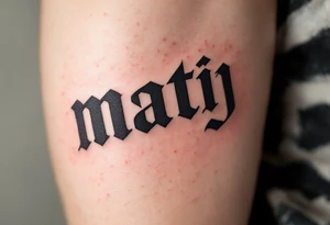Matěj in bold block letters, with a subtle sunrise gradient fading from orange to yellow. tattoo idea