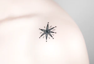 A star tattoo design. . black and white. small tattoo idea