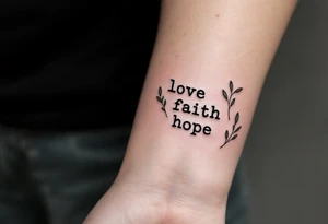 Minimalist black typewriter font love faith hope surrounded by delicate olive branches in deep green. tattoo idea