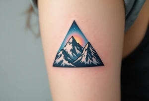 A triangle filled with mountains and shaded in charcoal and sky blue, symbolizing adventure and strength. tattoo idea