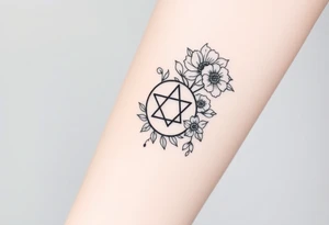 Large fine line florals that cover up an enneagram symbol tattoo idea