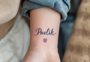 Pavlík written above a tiny pair of baby shoes in dusty blue. tattoo idea