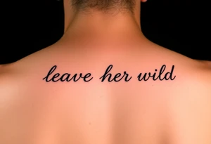 small fine line script tattoo of words "leave her wild" tattoo idea