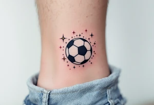A small ankle tattoo of a pastel blue soccer ball with sparkles around it for a playful look. tattoo idea