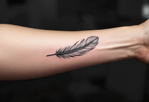 A single soft grey feather drifting down the forearm, capturing the lightness of freedom. tattoo idea