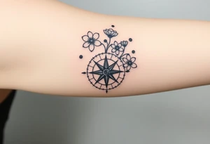 Abstract Compass with large wild flowers flowing above and below the compass tattoo idea